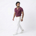 Man wearing a maroon shirt and white pants on a white background